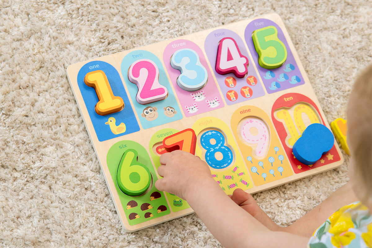 Image of a child having fun playing with Let's Count To 10 Puzzle