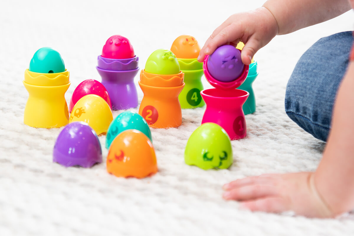 Image of a child having fun playing with Sort 'N Match Egg Stackers