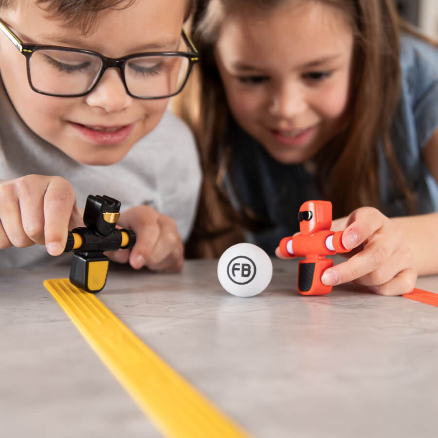 Image of children having fun playing with Foosbots