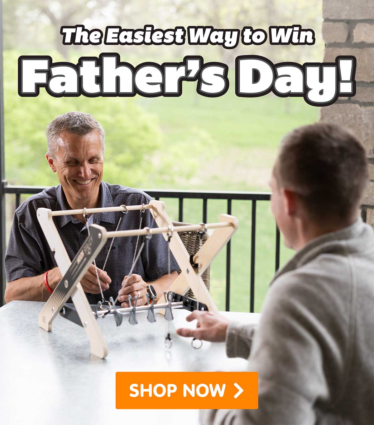 Image of a father and son playing the game Hook Raly with the text - The Easiest Way to Win Father's Day! - Shop Now