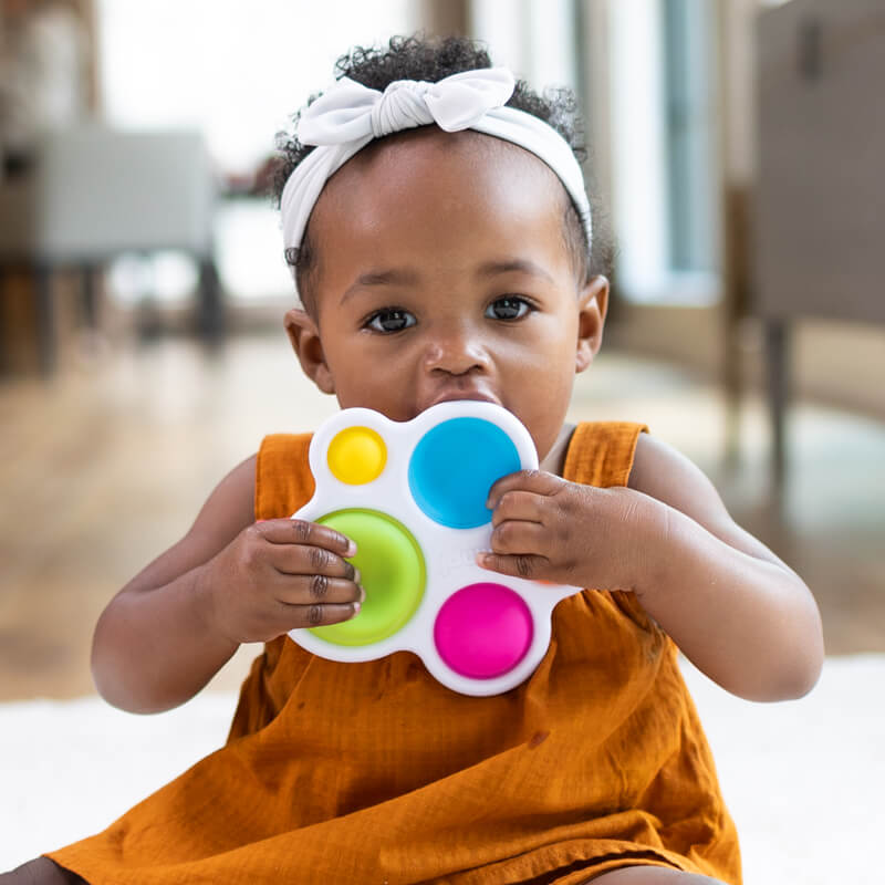 Child having fun playing with Dimpl!